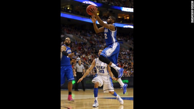 Jahenns Manigat of Creighton shoots over Seth Curry of Duke on March 24.