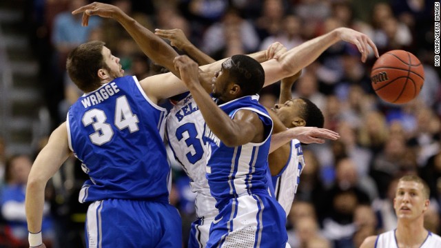 Creighton and Duke players battle for a loose ball in the first half on March 24.