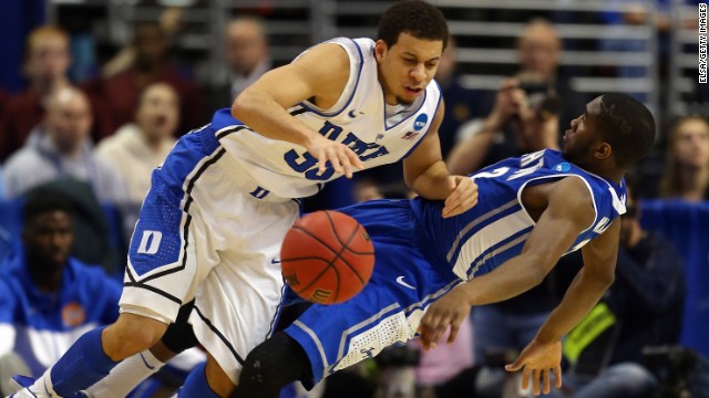 Seth Curry of Duke, left, is fouled by Jahenns Manigat of Creighton on March 24.