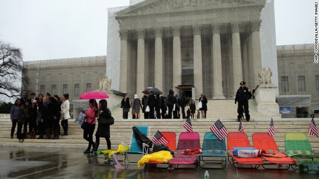 Colorful beach chairs lined up by demonstrators sit in front of the U.S. Supreme Court on Monday, March 25, in Washington.