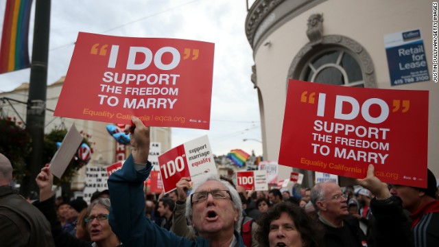 Supporters of same-sex marriage hold signs during a rally in support of marriage equality on Monday in San Francisco. 