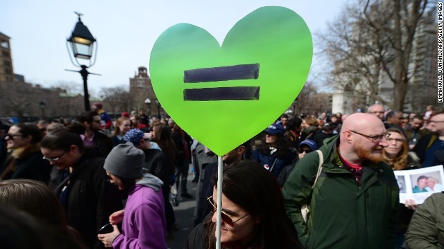 People move through the demonstration in New York on Sunday.