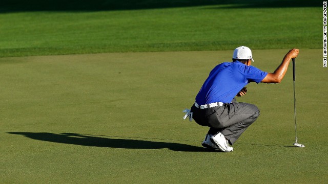 Woods lines up his putt at the Honda Classic at PGA National in March 2012. He shot a 62, his lowest final round as a professional, at the Honda Classic, but he tied for second in the tournament.