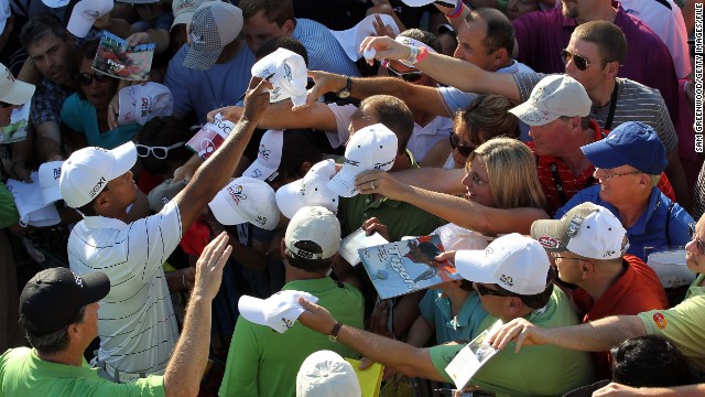 Woods signs autographs at the Arnold Palmer Invitational in March 2012. His win there marked his first PGA tour victory since September 2009.