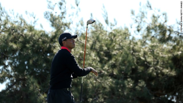 Woods hits his tee shot on the 12th hole during the final round of the Farmers Insurance Open at Torrey Pines in January 2013. He lost his title the previous year as the world's top-paid athlete, dropping to third place on Sports Illustrated's "Fortunate 50" list.