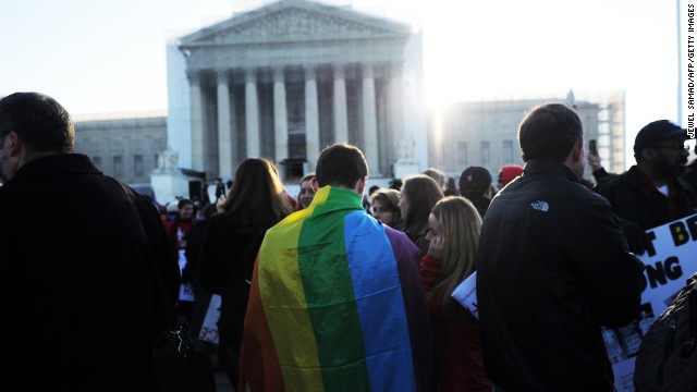 Supporters of same-sex marriage gather in front of the U.S. Supreme Court on Tuesday, March 26, in Washington. The justices will hear arguments on California's Proposition 8, which bans same-sex marriage. Dozens of people have camped out in hopes of attending the hearing, and rallies in support of same-sex marriage have been held throughout the country.