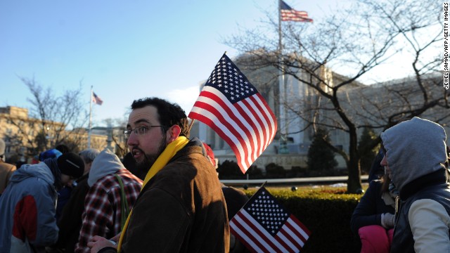People line up in front of the Supreme Court on Tuesday. 