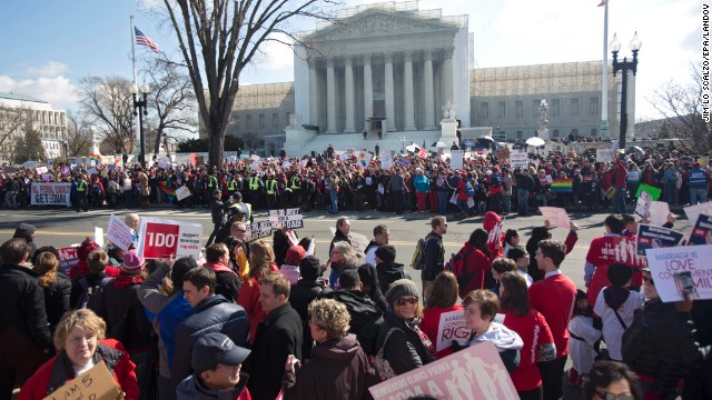 Crowds gather outside the Supreme Court on Tuesday as justices hear the first case on same-sex marriage.