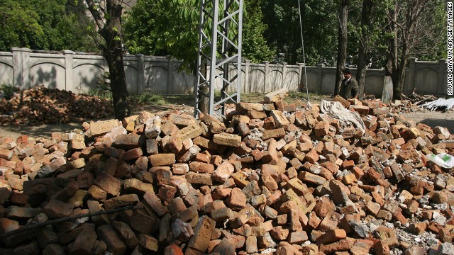 Shakeel Ahmad Yusufzai, a Pakistani contractor who worked to dismantle the compound, walks through the rubble left behind from the demolition on May 1, 2012.