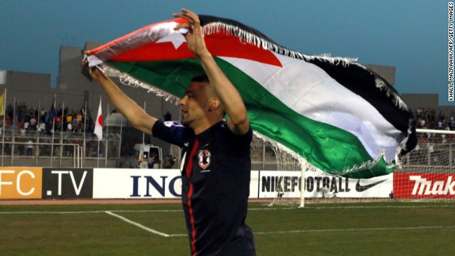 Ahmad Ibrahim celebrates after a 2-1 victory over Japan that took Jordan from bottom of Group B to second on Tuesday.