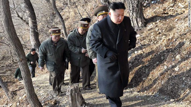 Kim makes his way to an observation post with North Korean soldiers on March 25.