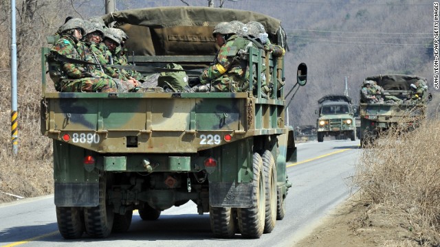 South Korean soldiers ride in a military truck in Paju on March 27.