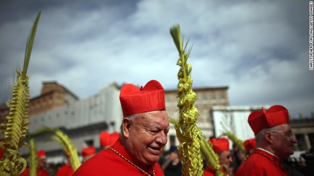 Cardinals proceed to the Obelisk as Pope Francis delivers his blessing of the palms during Palm Sunday Mass on March 24.