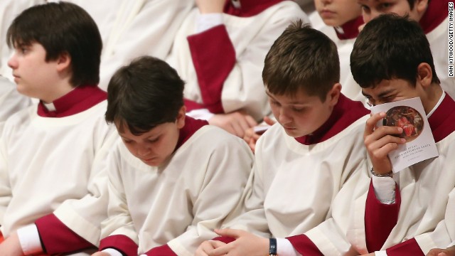 Choirboys fill a line of church benches on Thursday.