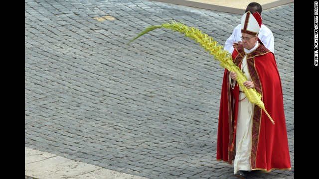 Pope Francis walks after blessing the palms on Palm Sunday, March 24.