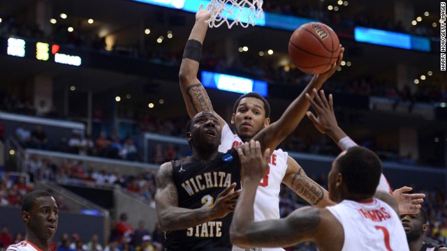 Malcolm Armstead of Wichita State goes up for a shot against Deshaun Thomas, center, and Amir Williams of Ohio State on March 30.