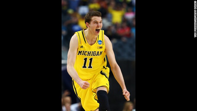 Nik Stauskas of Michigan celebrates after shooting a three-pointer.