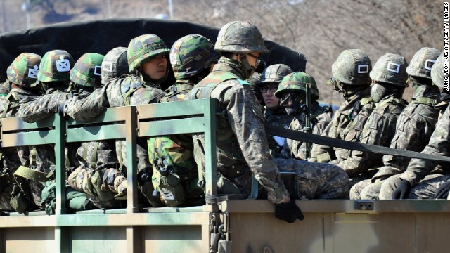 South Korean soldiers ride on a military truck in Paju on Friday, March 29.