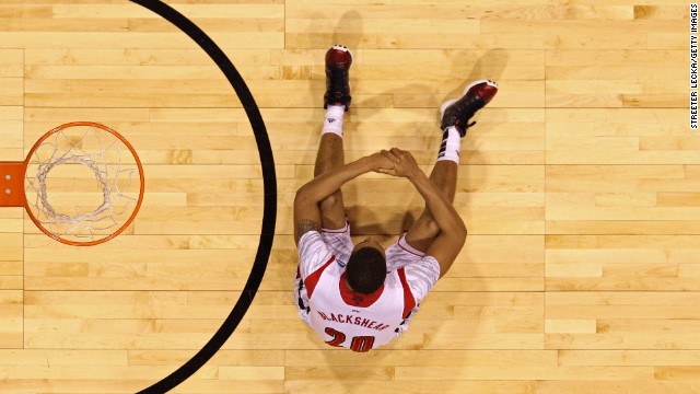 Wayne Blackshear of the Louisville Cardinals sits dejected under the basket.