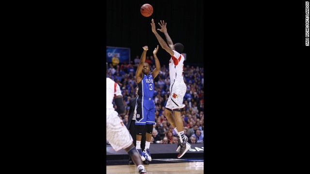 Ware tries to block Duke guard Tyler Thornton in the first half before landing awkwardly, snapping the bones in his lower leg.