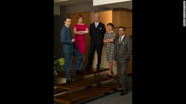 The cast poses in the Sterling Cooper Office.