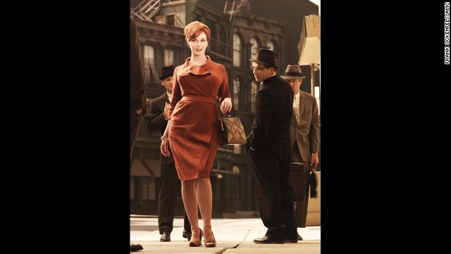 Joan Holloway attracts male attention wearing a flattering wrap dress in season 3.