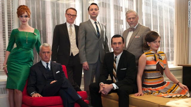 From left to right, Joan Harris, Roger Sterling, Lane Pryce, Pete Campbell, Don Draper, Bertram Cooper (Robert Morse) and Peggy Olson pose together at the office.