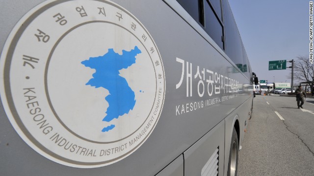 A South Korean soldier walks past a Kaesong Industrial District Management Committee bus at the Inter-Korean Transit Office in April.