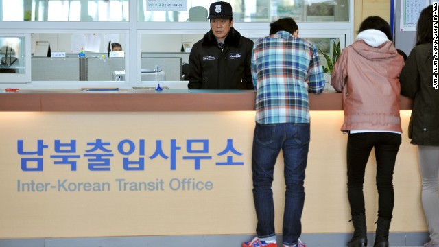 South Koreans stand in front of an information desk at the Inter-Korean Transit Office in Paju after being blocked from North Korea in April.