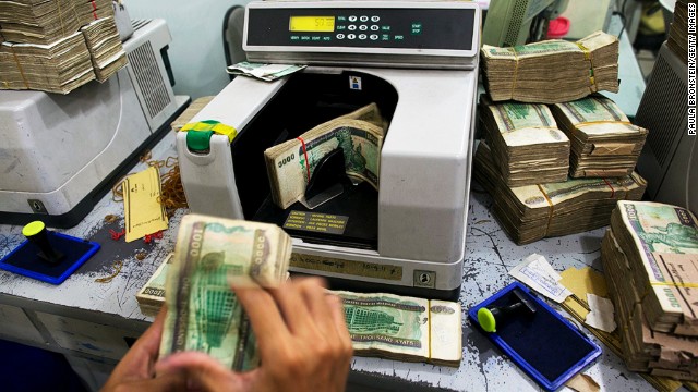 There are few ATMs in Myanmar, so visitors need to bring plenty of U.S. dollars. The higher the denomination, the better the exchange rate. This whole stack of kyat (pronounced chat) is worth about US$20. 