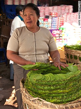 Chewing betel nut is a national pastime. Small street stalls, like this one in Mandalay, selling the palm-sized green leaves are everywhere. The leaves are filled with betel nut, spices and sometimes a pinch of tobacco, then folded and popped in the mouth and chewed.