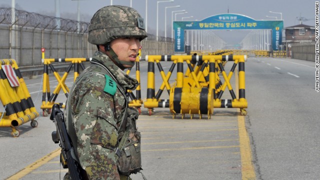 A South Korean soldier stands on a road linked to North Korea at a military checkpoint in Paju on Wednesday, April 3. After a week of threats to the United States and South Korea, North Korea blocked hundreds of South Korean workers from entering the industrial complex, which is an important symbol of cooperation between the two countries.