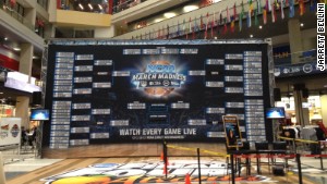 A giant March Madness bracket lives in the CNN Center atrium to remind visitors that they\'ve absolutely lost their office pool.