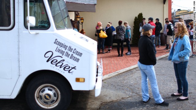 People line up to attend one of CD102.5's <a href='http://cd1025.com/the-big-room' >Big Room</a> concerts while one of the station's ice-cream trucks lingers out front. The station prides itself on being a part of the community.