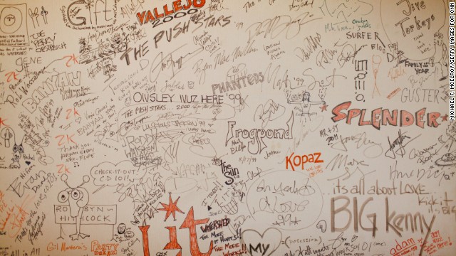 Bands that perform at the station leave their mark on walls around the Big Room.