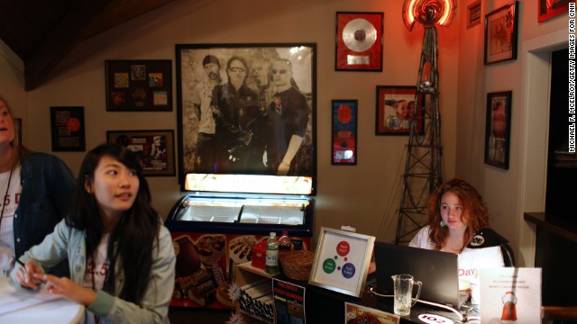 A U2 poster and other band memorabilia hang above an ice-cream cooler near the station's entrance.