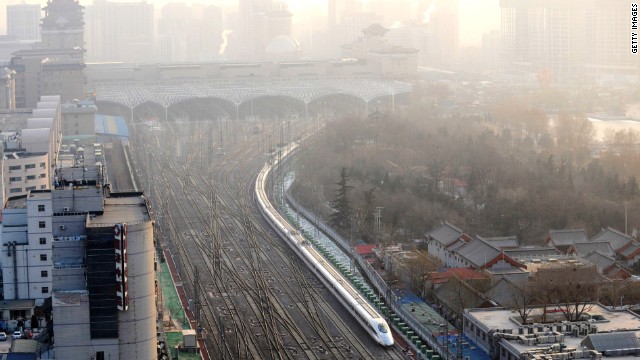 A train leaving Beijing West Rail Station. The world's longest high-speed rail line links Beijing and Guangzhou, China's southern hub 2,300 kilometers away.