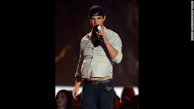 Taylor Lautner cheekily accepts his award for Best Shirtless Performance for "The Twilight Saga: Breaking Dawn -- Part 2." He joked that he's grown a bit of a beer belly since the franchise has wrapped.