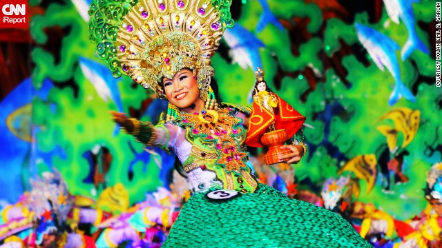 A performer wears a brightly colored costume at the 2013 Sinulog Festival, which celebrates the Philippines' religious history. See more photos on <a href='http://ireport.cnn.com/docs/DOC-919869'>CNN iReport</a>.