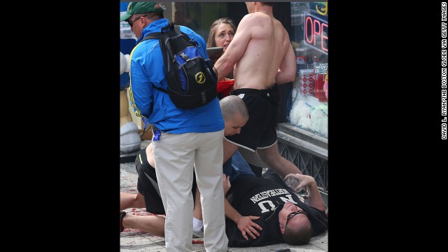 A man lays on the ground after the incident.