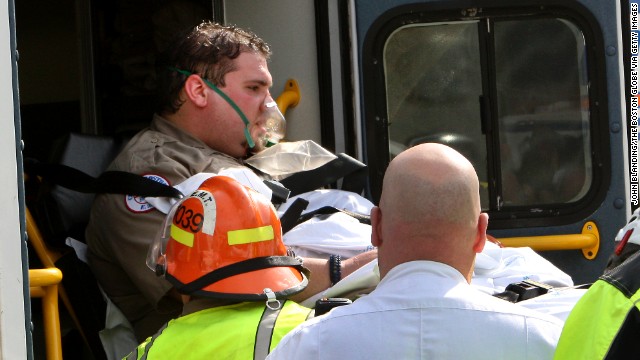 An EMT worker is transferred to an ambulance outside a medical tent in Copley Square.