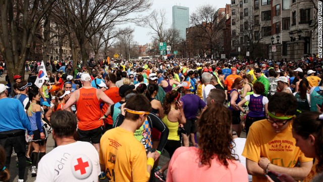 Runners gather near Kenmore Square after the explosions.