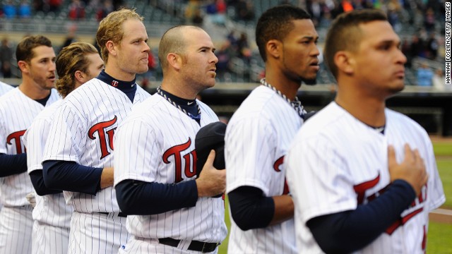 The Minnesota Twins stand during the national anthem before their game on Monday, April 15, in Minneapolis, following a moment of silence to honor the victims of the Boston Marathon bombings.