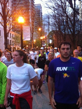 CNN staff member Emily Smith photographed Atlanta runners Tuesday morning running a silent mile in memory of those killed and injured in Monday's Boston Marathon blasts. "It was an emotional morning, with many runners wearing Boston sports teams logos," she says. 