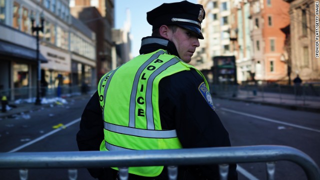 A police officer stands on duty in Boston on April 16. 