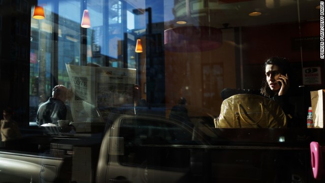 People have breakfast at a Boston cafe on April 16.