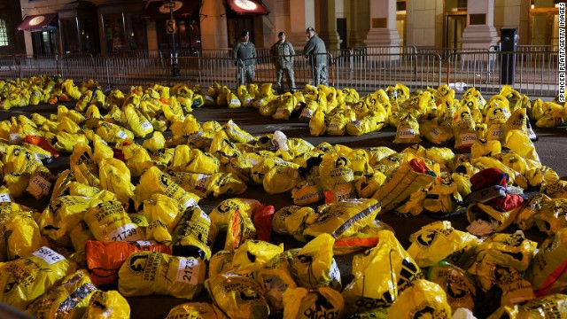 Unclaimed finish line bags litter the ground near the bombing sites. A day after the terror attack, authorities warned city residents to keep their guard up amid a massive investigation into the bombings.