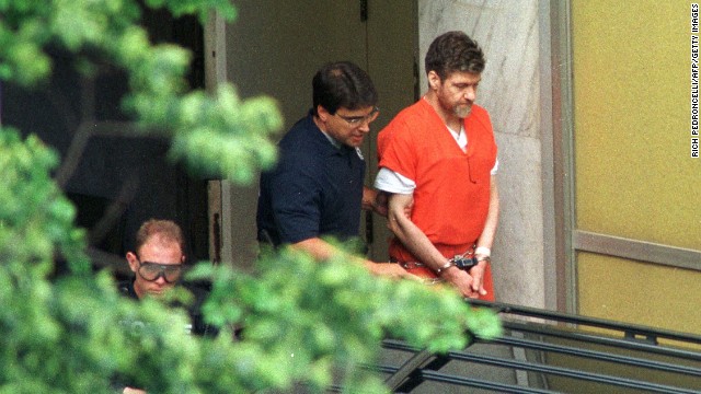 Justice finally catches up with Ted Kaczynski, who is escorted by U.S. marshals outside Sacramento County Federal Court in California in May 1998 after receiving life sentences for his crimes.