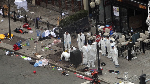 Investigators work at an area of the crime scene on Boylston Street on April 16.