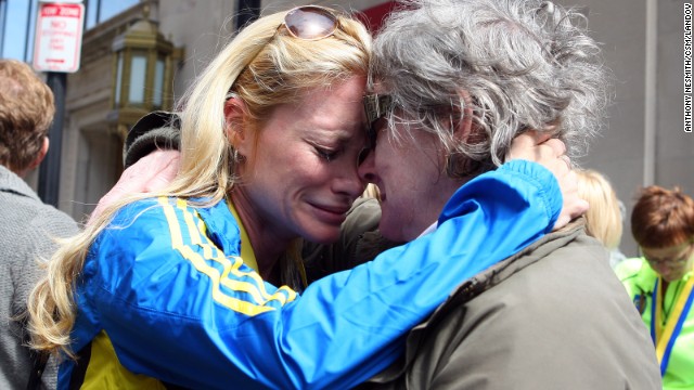 Nicole Rand, left, who ran the marathon, embraces with her mother, Maureen Joham, on April 16 as she recounts her experience in Boston.